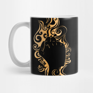 Raised fist in golden fire Mug