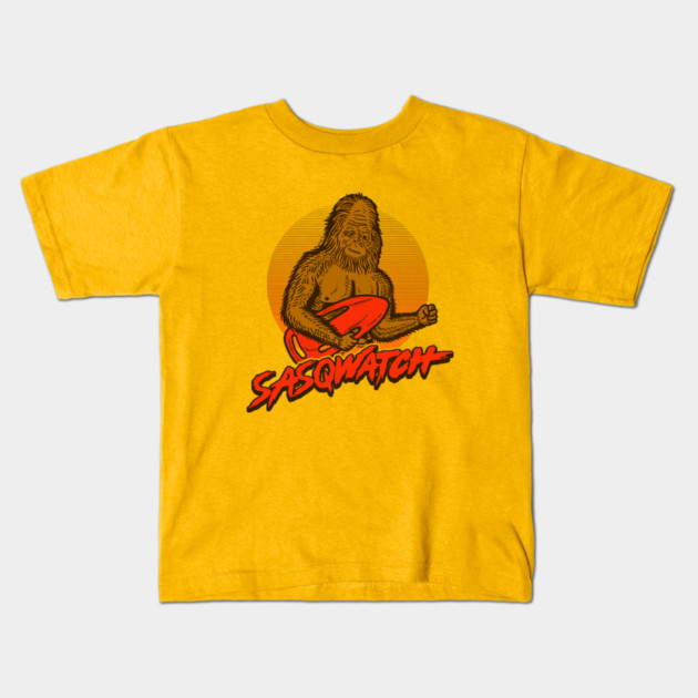 Sasq Watch Kids T-Shirt by dumbshirts