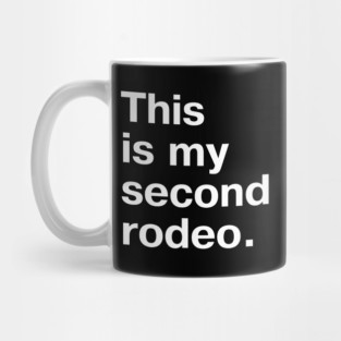 "This is my second rodeo." in plain white letters - cos you're not the noob, but barely Mug