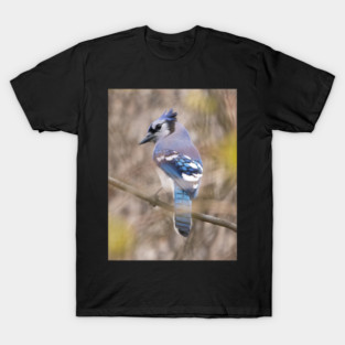 Blue Jay with brown and grey blurred background and green blurred leaves T-Shirt