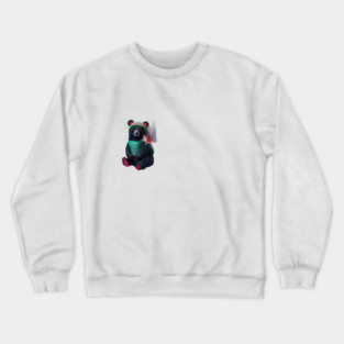 black bear wearing a green bib with the text “WHAT YOU MEAN JUICE FREE?” and a green hat with red dots. The bear is holding a fish in its left paw and sitting with its right paw resting on its leg, displaying pink pads on the soles of its feet Crewneck Sweatshirt