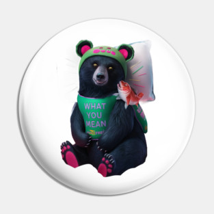 black bear wearing a green bib with the text “WHAT YOU MEAN JUICE FREE?” and a green hat with red dots. The bear is holding a fish in its left paw and sitting with its right paw resting on its leg, displaying pink pads on the soles of its feet Pin