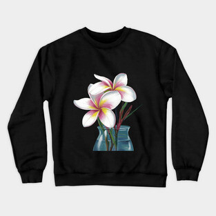 Small Bouquet of Plumeria Flowers with White Petals and Yellow and Pink Accents, Placed in a Blue Vase Against a Plain Crewneck Sweatshirt