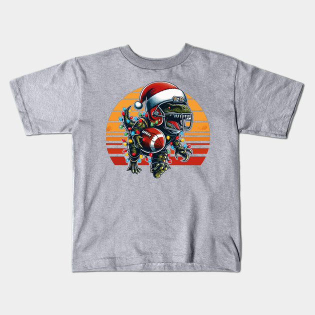 American Football T-Rex Santa Hat Kids T-Shirt by JessArty