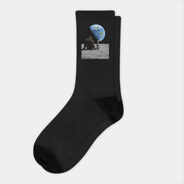 Bigfoot and Alien Watching the Earth from the Moon Socks by Megadorim