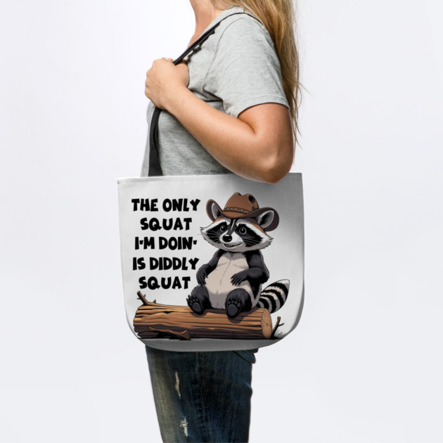 The Only Squat I’m Doin’ Is Diddly Squat - Funny Cowboy Raccoon by Creatifly Graphic Tees