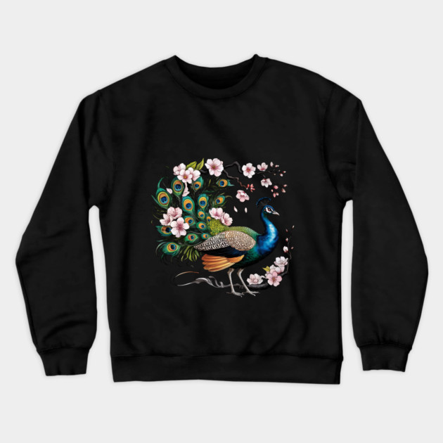 Vibrant Peacock Among Cherry Blossoms and Petal Swirls Crewneck Sweatshirt by BirdsnStuff