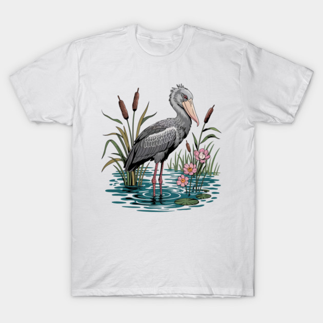 Shoebill Stork Among Wetland Flowers T-Shirt by BirdsnStuff