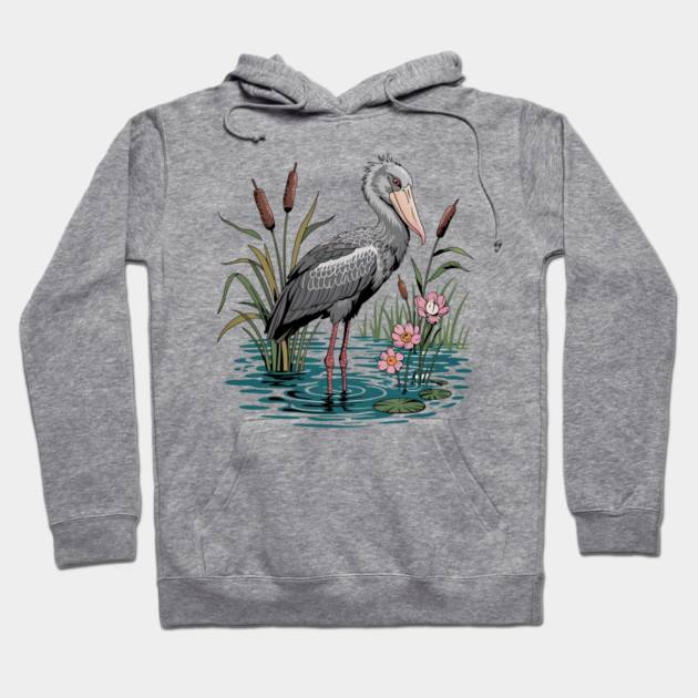 Shoebill Stork Among Wetland Flowers Hoodie by BirdsnStuff