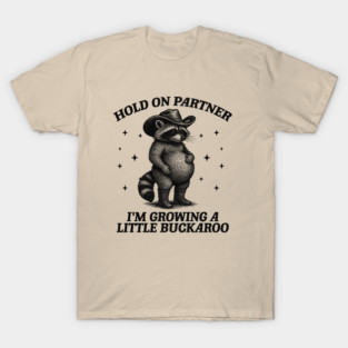 Hold On Partner I'm Growing A Little Buckaroo, Retro Cartoon T Shirt, Cowboy Raccoon Shirt, Cowgirl Pregnancy, Trash Panda t shirt, Baby Cowboy Tee, Funny Racoon Meme T-Shirt