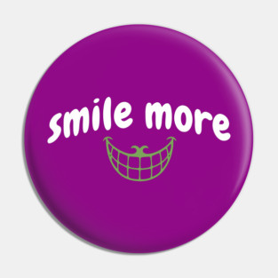 Smile More Cheshire Grin – Whimsical Smile Face with Creepy Grin, White Text Green Smile Pin