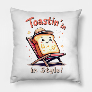 There is a toast in a chair with a hat on Pillow