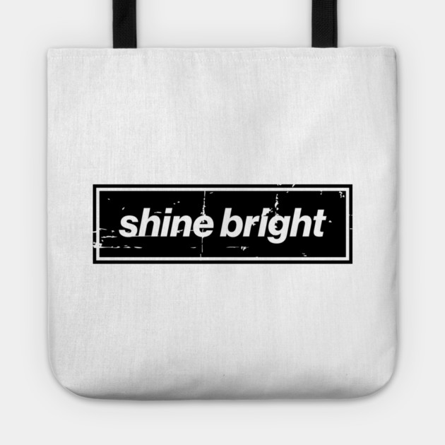 Shine Bright Oasis Distressed Typography – Bold Positive Message Design Black Tote by Butter Creative