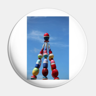 Colorful Buoy Tower Against Blue Sky Pin