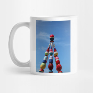 Colorful Buoy Tower Against Blue Sky Mug