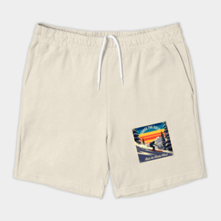 Retro Ski Poster with Snowy Pines, Mountains, and Warm Sky Colors Shorts