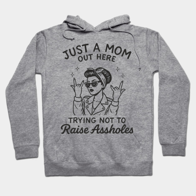 Just a Mom Trying Not to Raise A**holes Motherhood Sarcam Hoodie by Anticorporati