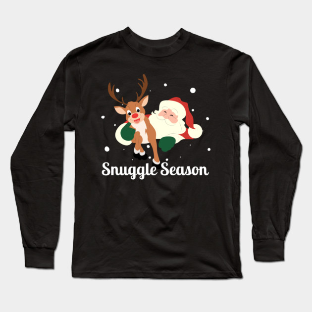 Snuggle Season - Jolly Santa With Friendly Reindeer in Falling Snow Long Sleeve T-Shirt by Creatifly Graphic Tees