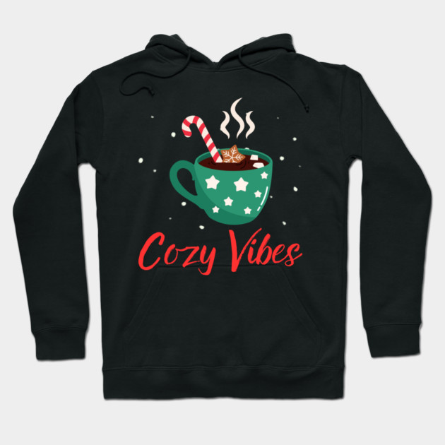 Cozy Vibes Hot Chocolate Mug with Marshmallows on Snowy Black Hoodie by Creatifly Graphic Tees