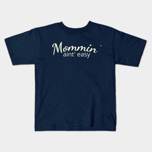 Mommin' aint easy Kids T-Shirt by DIGITAL MERCH CREATIONS