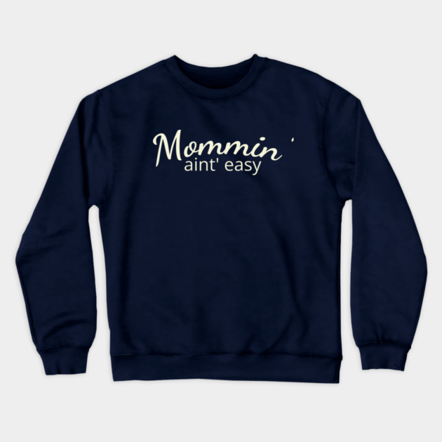 Mommin' aint easy Crewneck Sweatshirt by DIGITAL MERCH CREATIONS