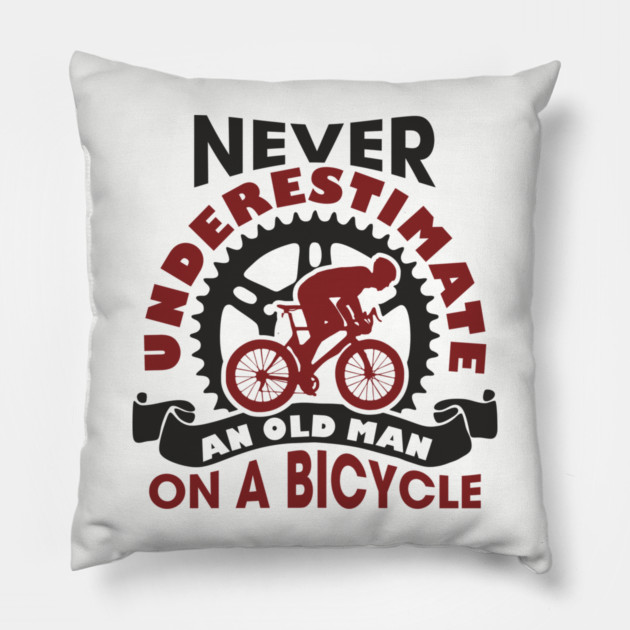 Never Underestimate an Old Man on a Bicycle Pillow by Anticorporati