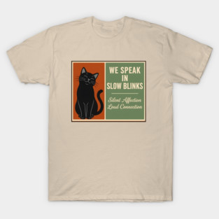 WE SPEAK IN SLOW BLINKS. T-Shirt