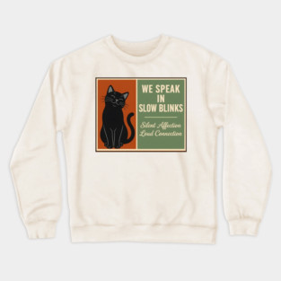 WE SPEAK IN SLOW BLINKS. Crewneck Sweatshirt